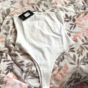 Cute white lace bodysuit. New Never worn with tags